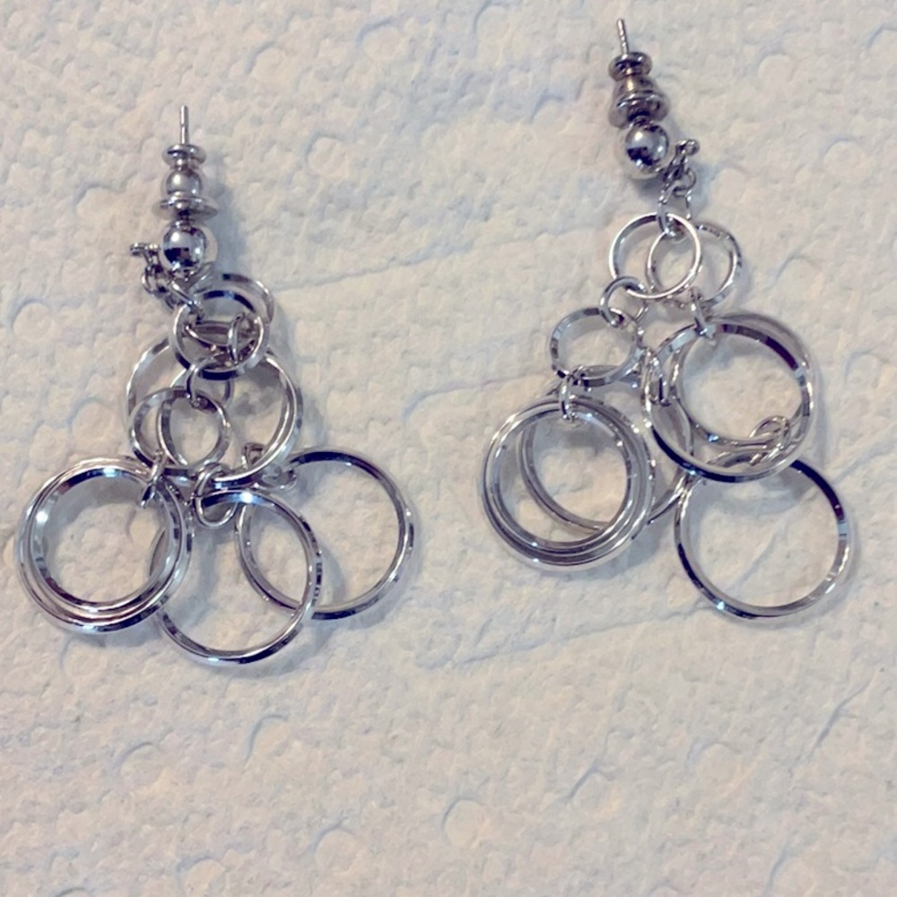 Silver plated dangle earrings that are 2 inches long and great condition.